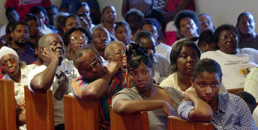 black people praying in church